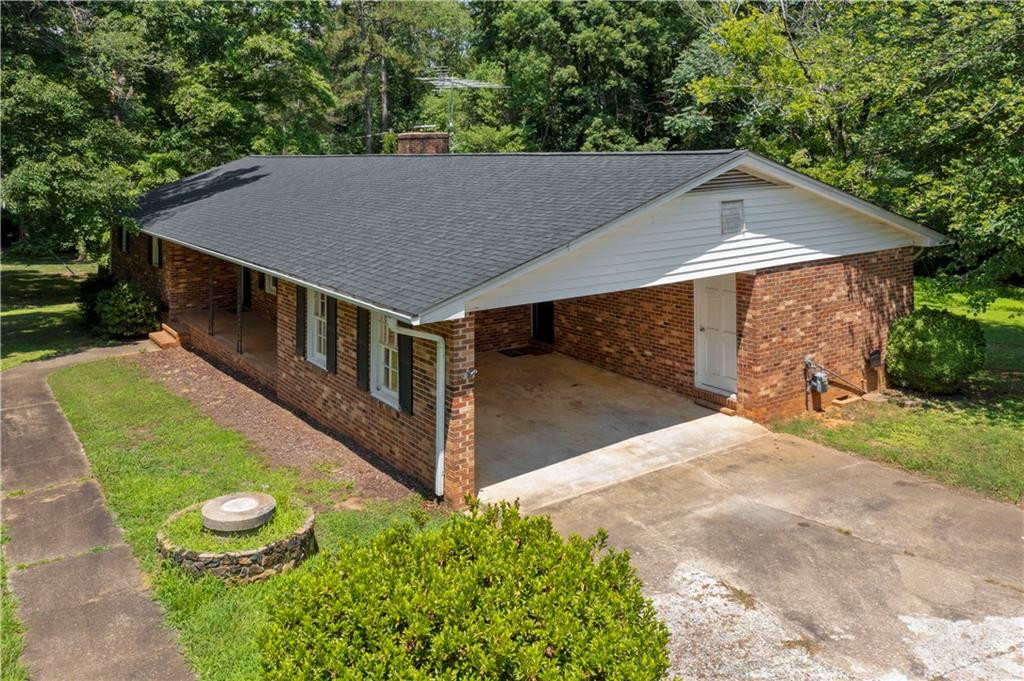 137 Roxdale Place Roxboro, NC 27574 - Photo 10 of 30 a aerial view of a house with yard and trees in the background