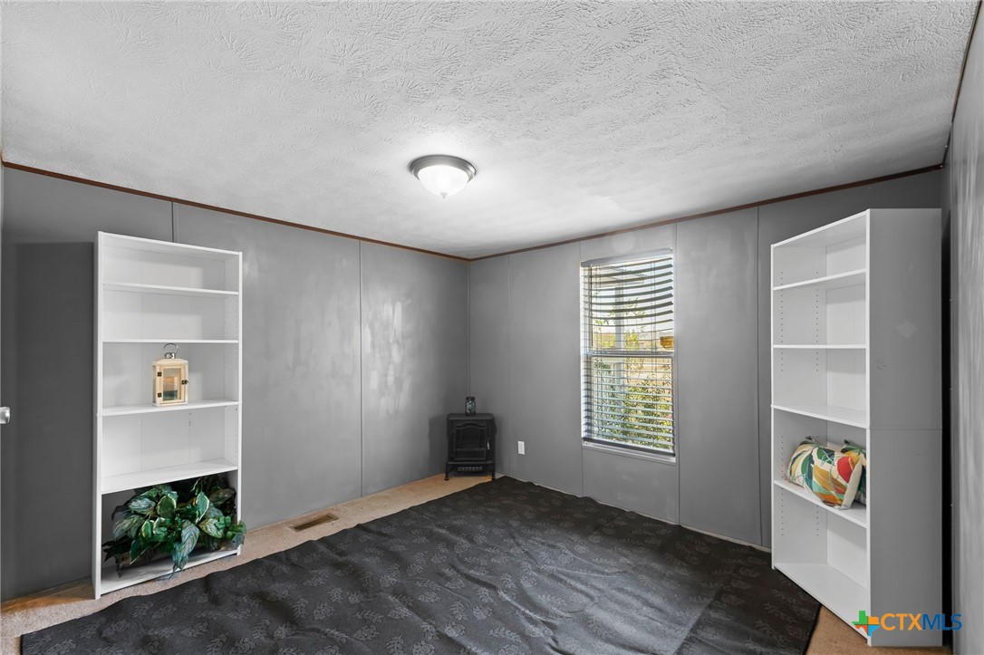 14815 Johnson Rd Trail Manor, TX 78653 - Photo 27 of 37 an empty room with windows