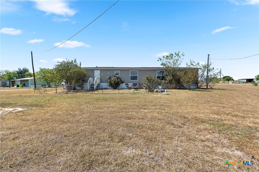 14815 Johnson Rd Trail Manor, TX 78653 - Photo 34 of 37 a view of a town with floor to ceiling windows