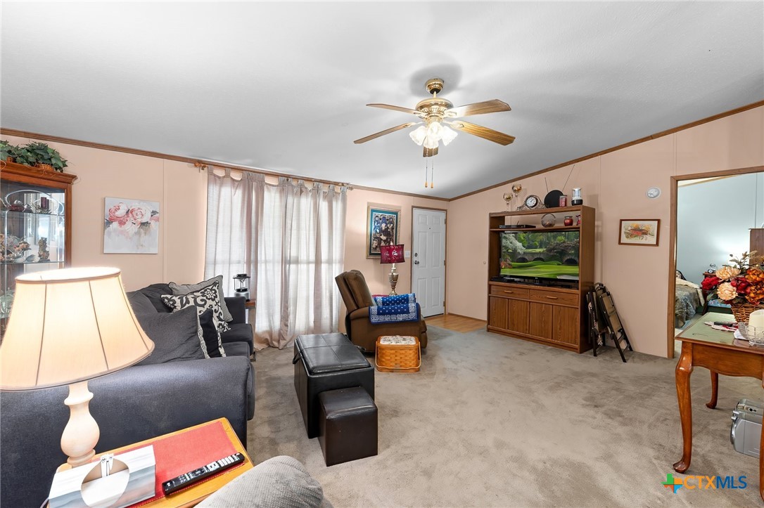 14815 Johnson Rd Trail Manor, TX 78653 - Photo 5 of 37 a living room with furniture and a flat screen tv