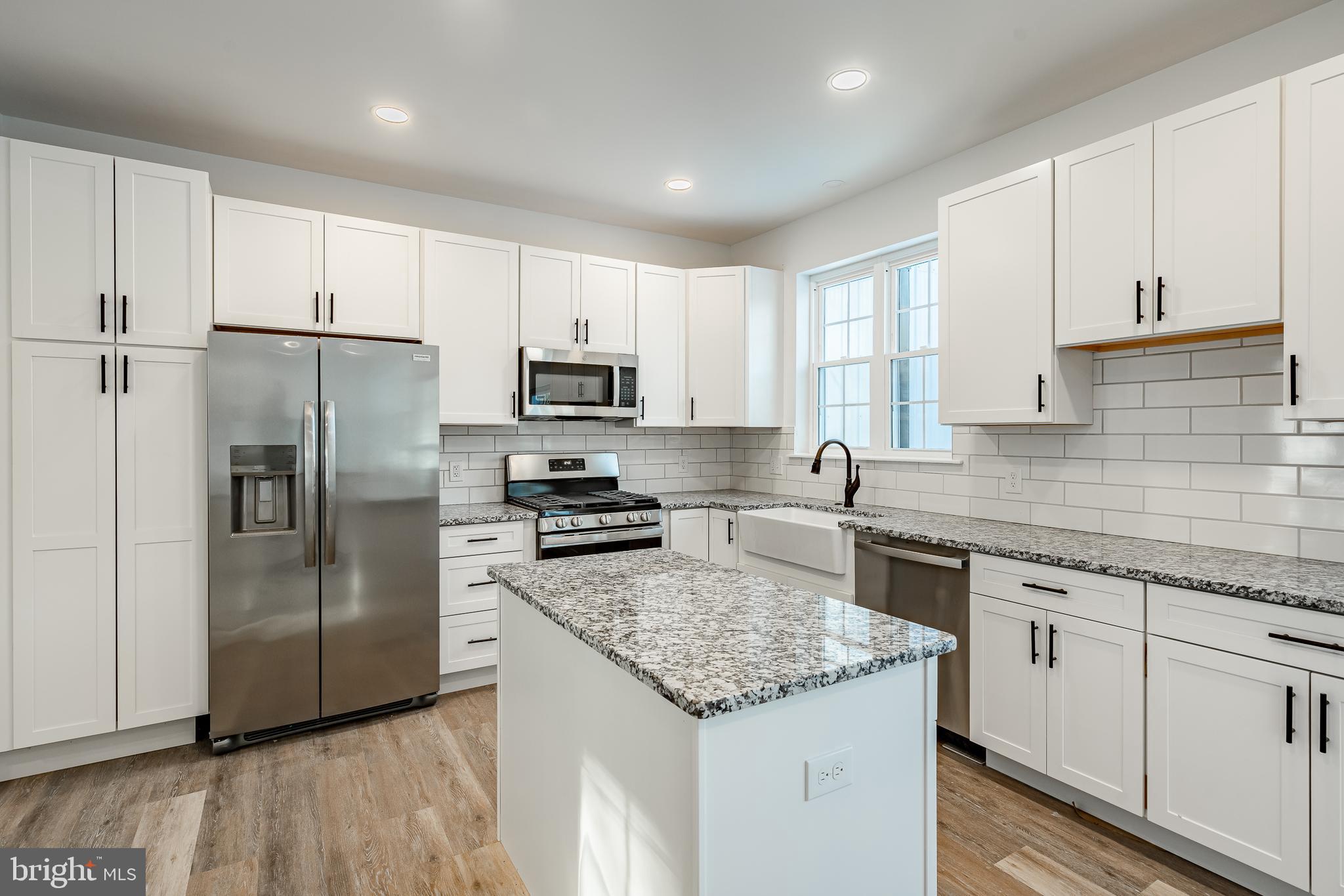 1150 Church Lane Road Reading, PA 19606 - Photo 9 of 45 a kitchen with stainless steel appliances granite countertop a refrigerator a sink a stove a microwave and island