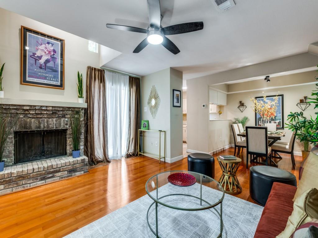 5626 Preston Oaks Road, Unit 46C Dallas, TX 75254 - Photo 10 of 25 a living room with furniture and a fireplace