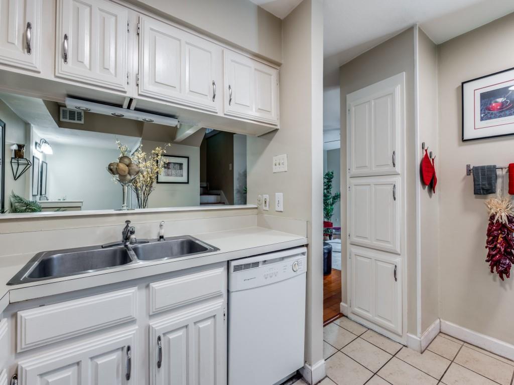5626 Preston Oaks Road, Unit 46C Dallas, TX 75254 - Photo 12 of 25 a kitchen with stainless steel appliances granite countertop a sink and cabinets