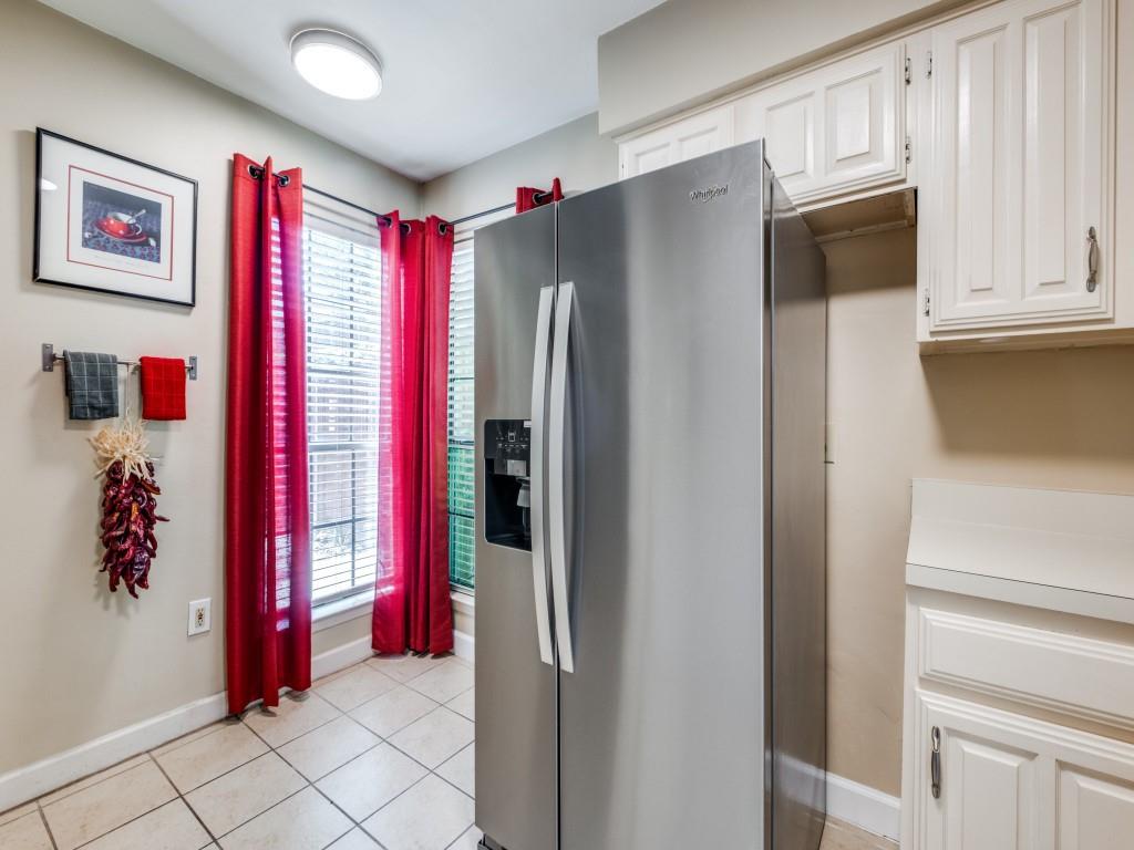 5626 Preston Oaks Road, Unit 46C Dallas, TX 75254 - Photo 14 of 25 a kitchen with stainless steel appliances granite countertop a refrigerator and a sink