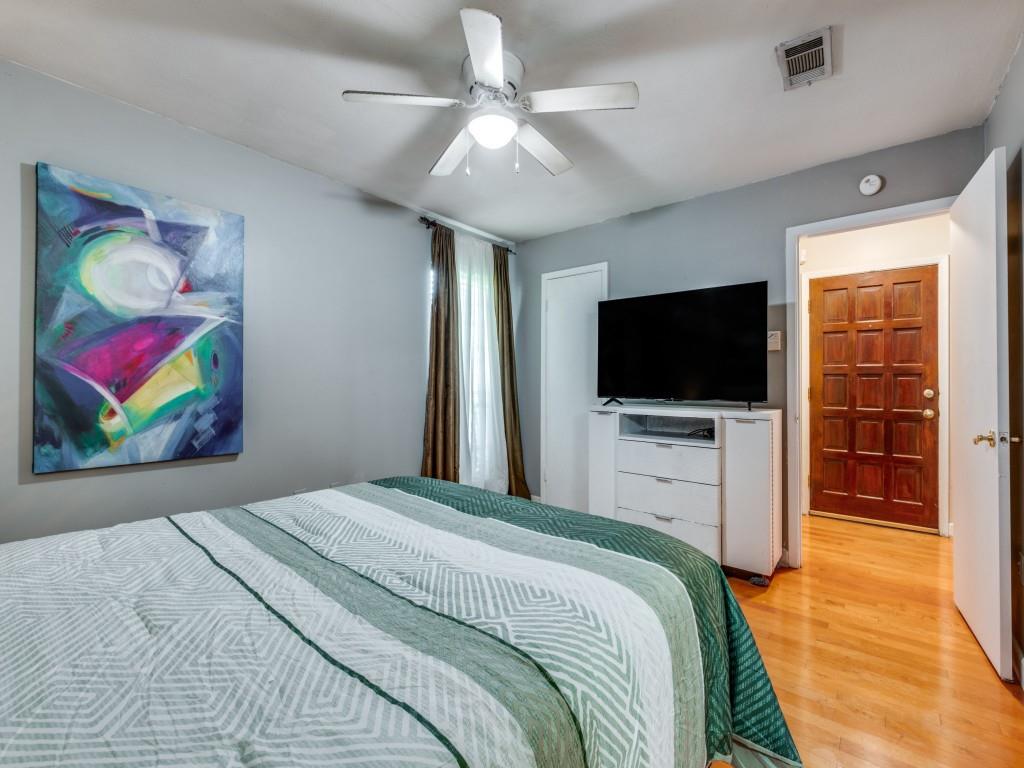 5626 Preston Oaks Road, Unit 46C Dallas, TX 75254 - Photo 15 of 25 a bedroom with a bed and a flat screen tv