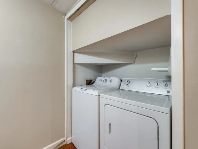 a view of storage and utility room with washer and dryer