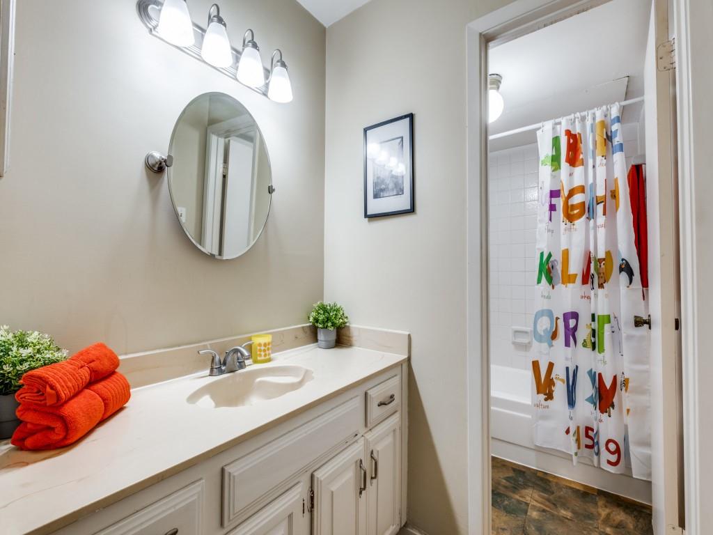 5626 Preston Oaks Road, Unit 46C Dallas, TX 75254 - Photo 20 of 25 a bathroom with a sink mirror and vanity