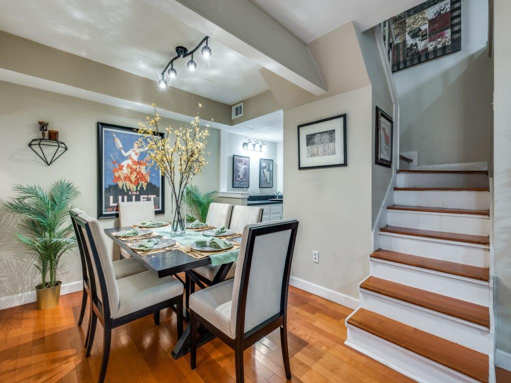 5626 Preston Oaks Road, Unit 46C Dallas, TX 75254 - Photo 3 of 25 a view of a dining room with furniture a chandelier and wooden floor