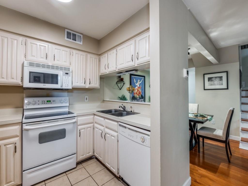5626 Preston Oaks Road, Unit 46C Dallas, TX 75254 - Photo 5 of 25 a kitchen with cabinets appliances and a window