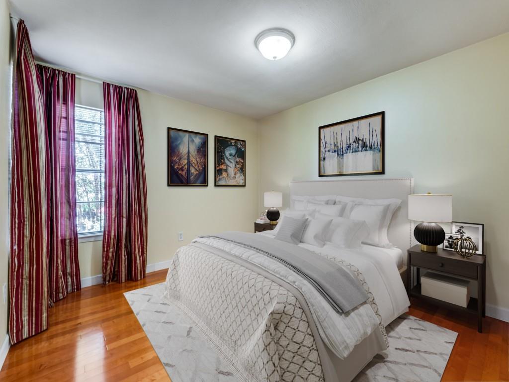 5626 Preston Oaks Road, Unit 46C Dallas, TX 75254 - Photo 8 of 25 a bedroom with a large bed and a window