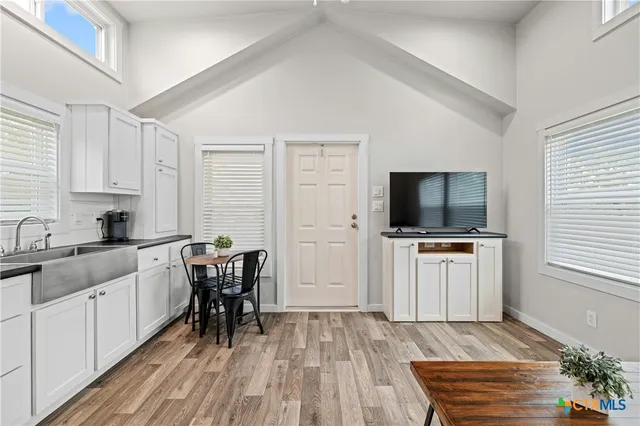 a kitchen with a workspace and a window