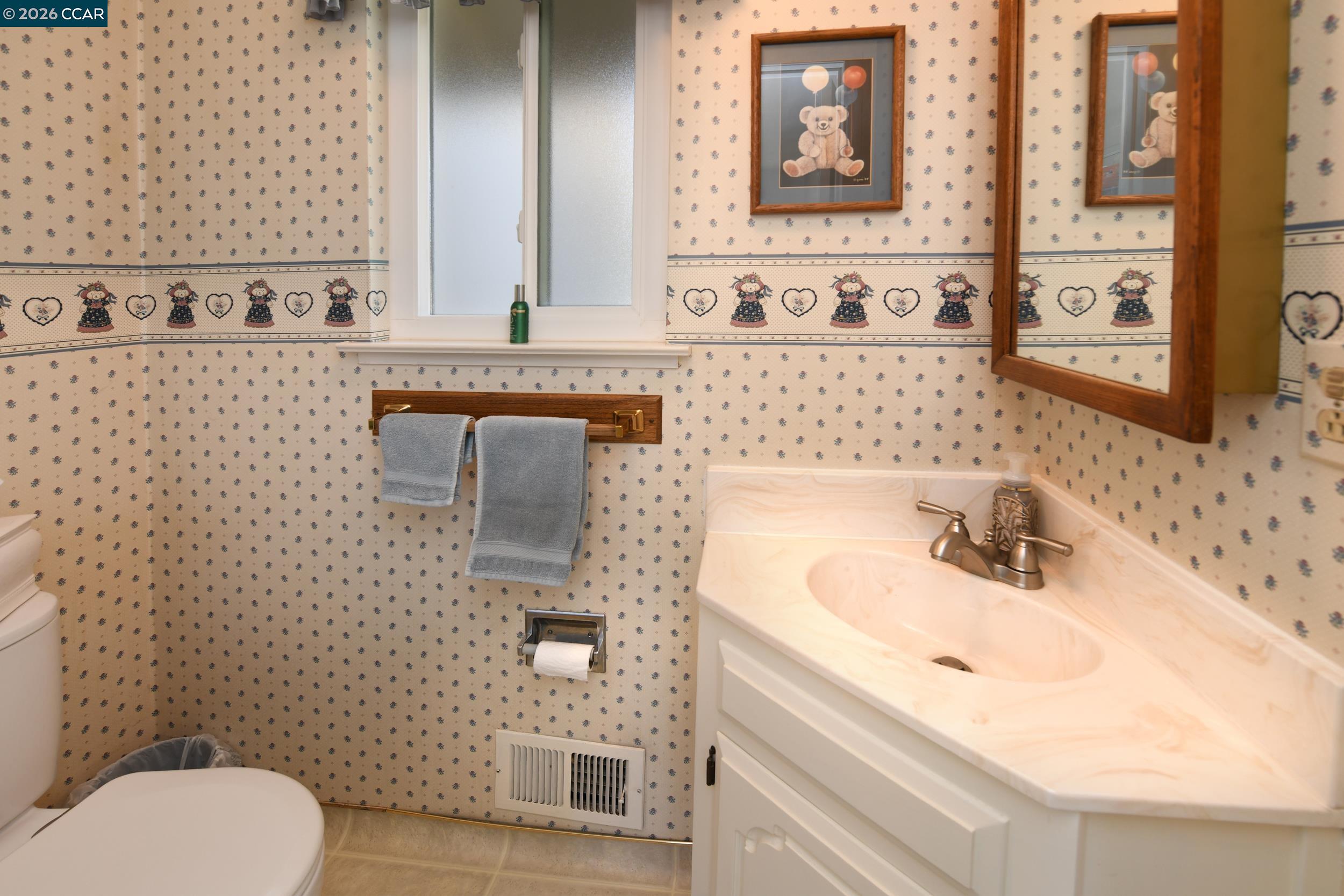 314 Semillon Circle Clayton, CA 94517 - Photo 14 of 38 a bathroom with a sink a toilet and mirror