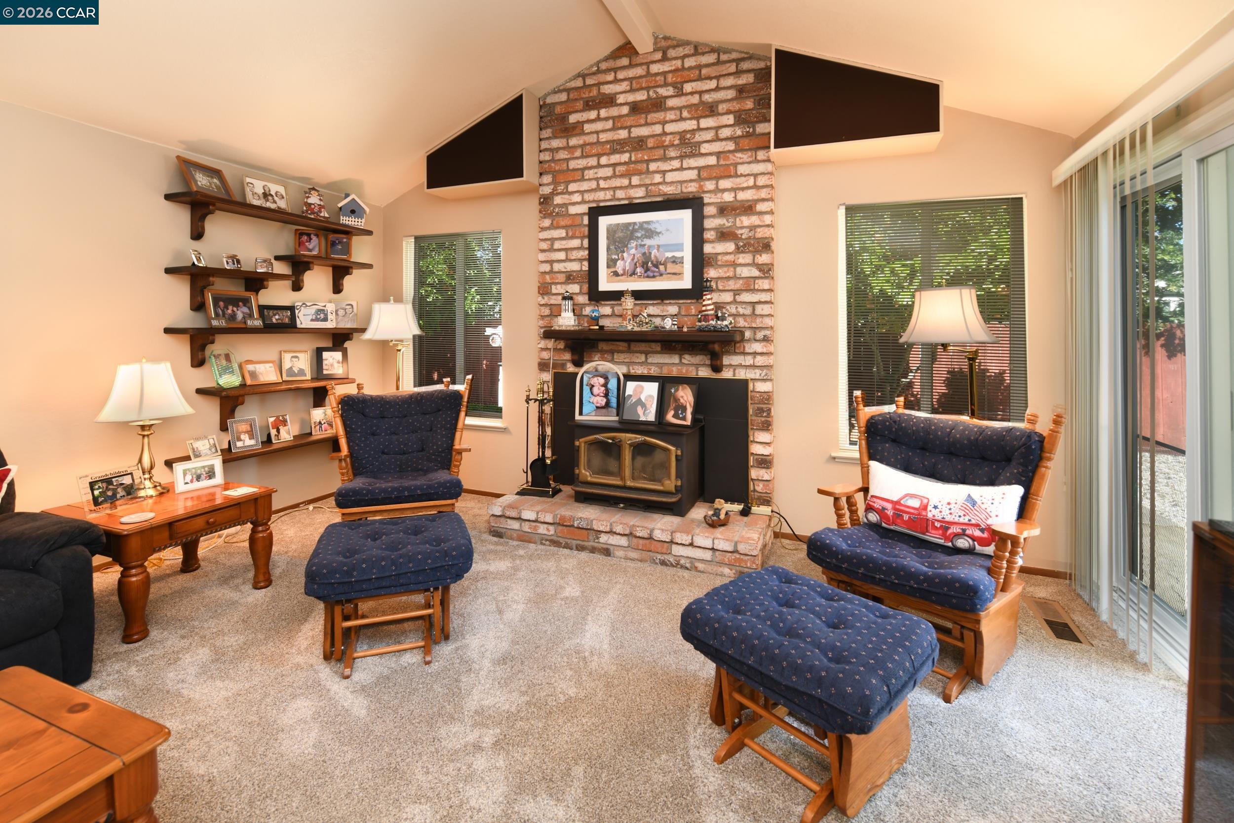 314 Semillon Circle Clayton, CA 94517 - Photo 15 of 38 a living room with furniture and a fireplace
