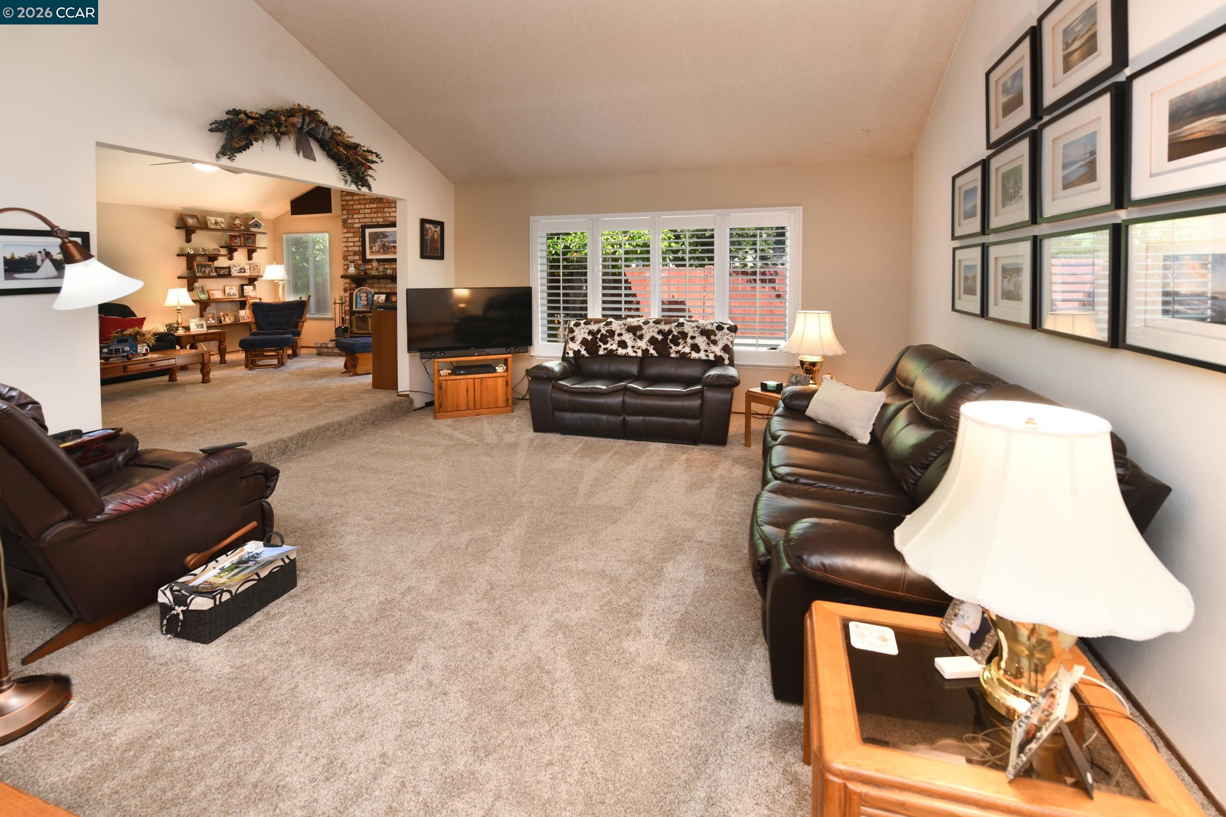 314 Semillon Circle Clayton, CA 94517 - Photo 17 of 38 a living room with furniture and a window