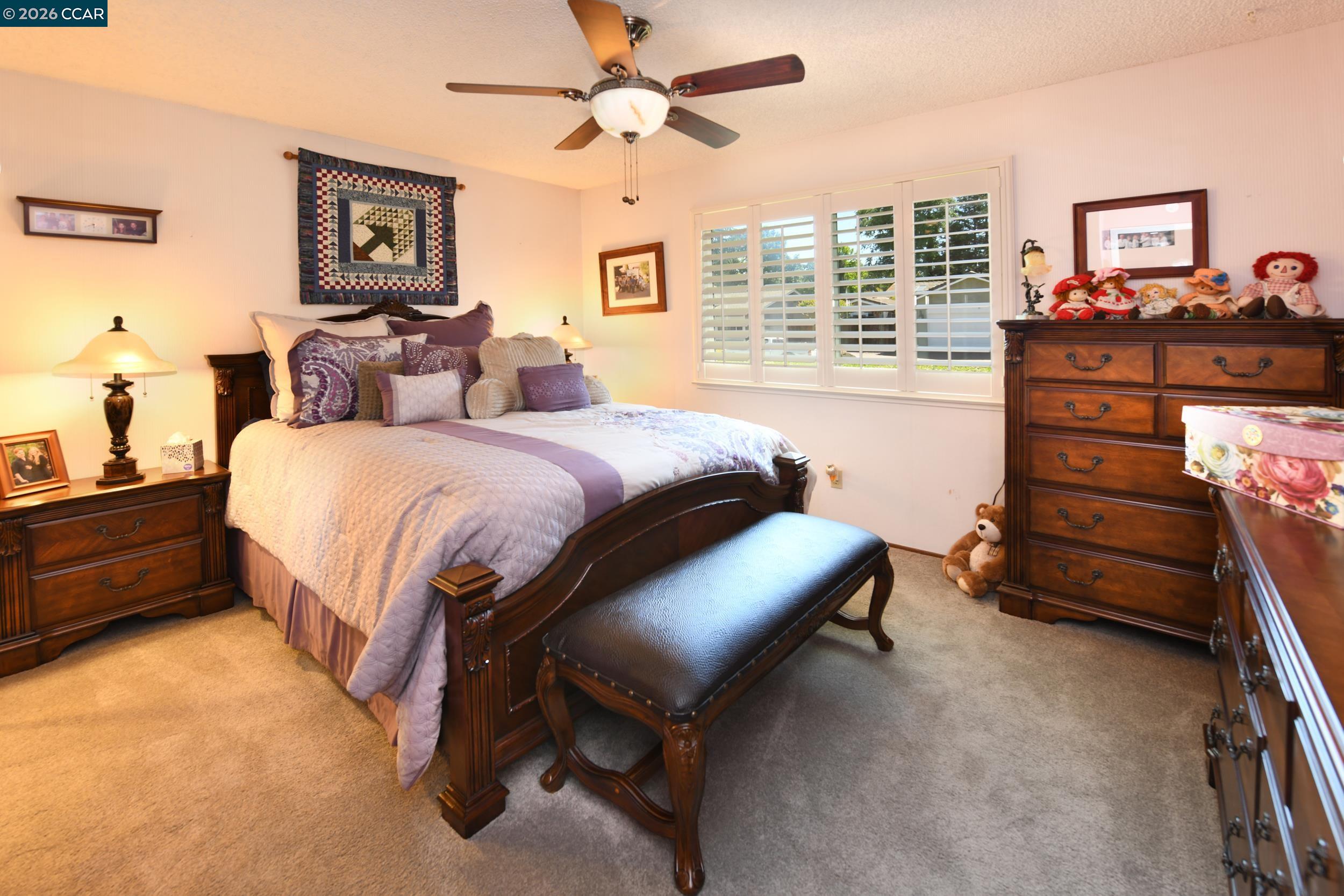 314 Semillon Circle Clayton, CA 94517 - Photo 23 of 38 a bedroom with a bed and a dresser
