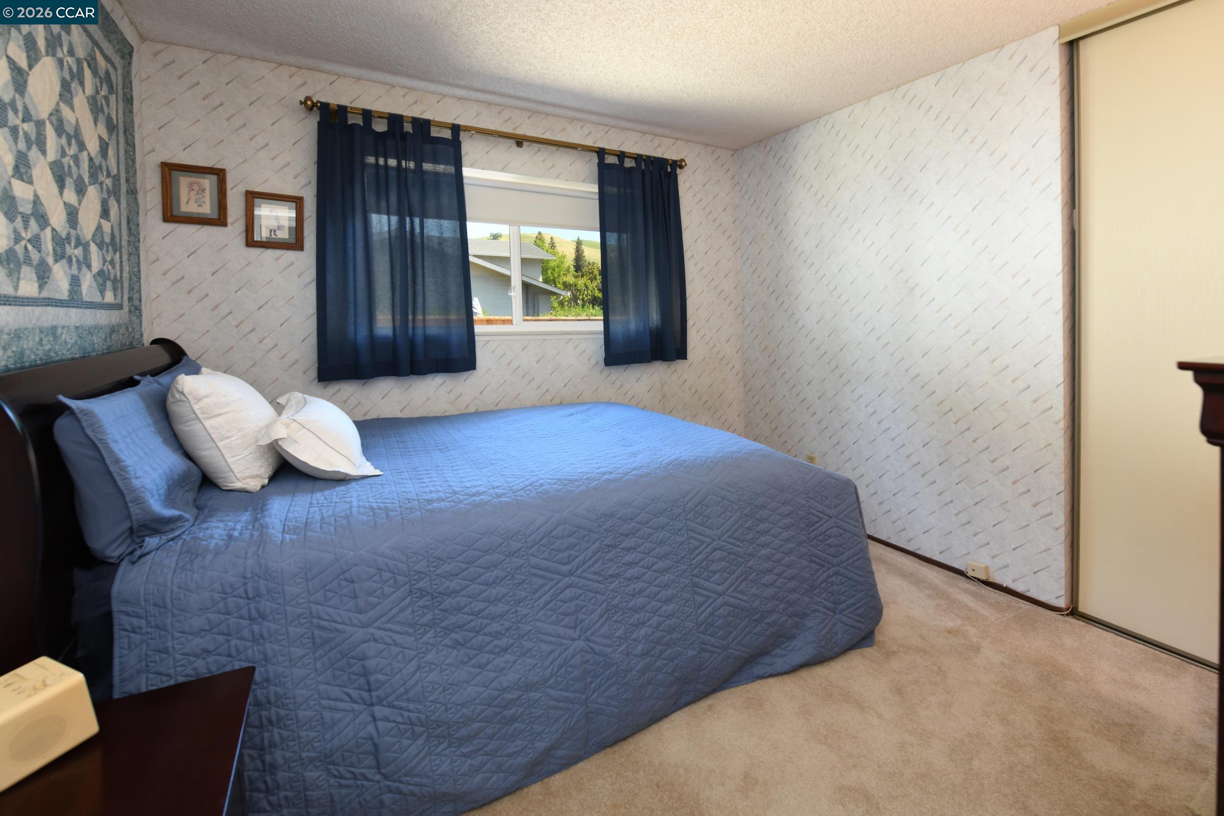 314 Semillon Circle Clayton, CA 94517 - Photo 25 of 38 a bedroom with a bed and window