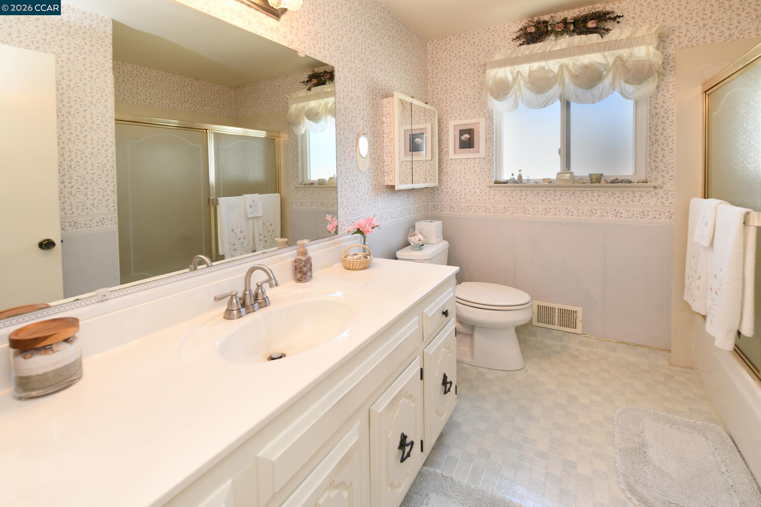 314 Semillon Circle Clayton, CA 94517 - Photo 26 of 38 a bathroom with a double vanity sink mirror and toilet
