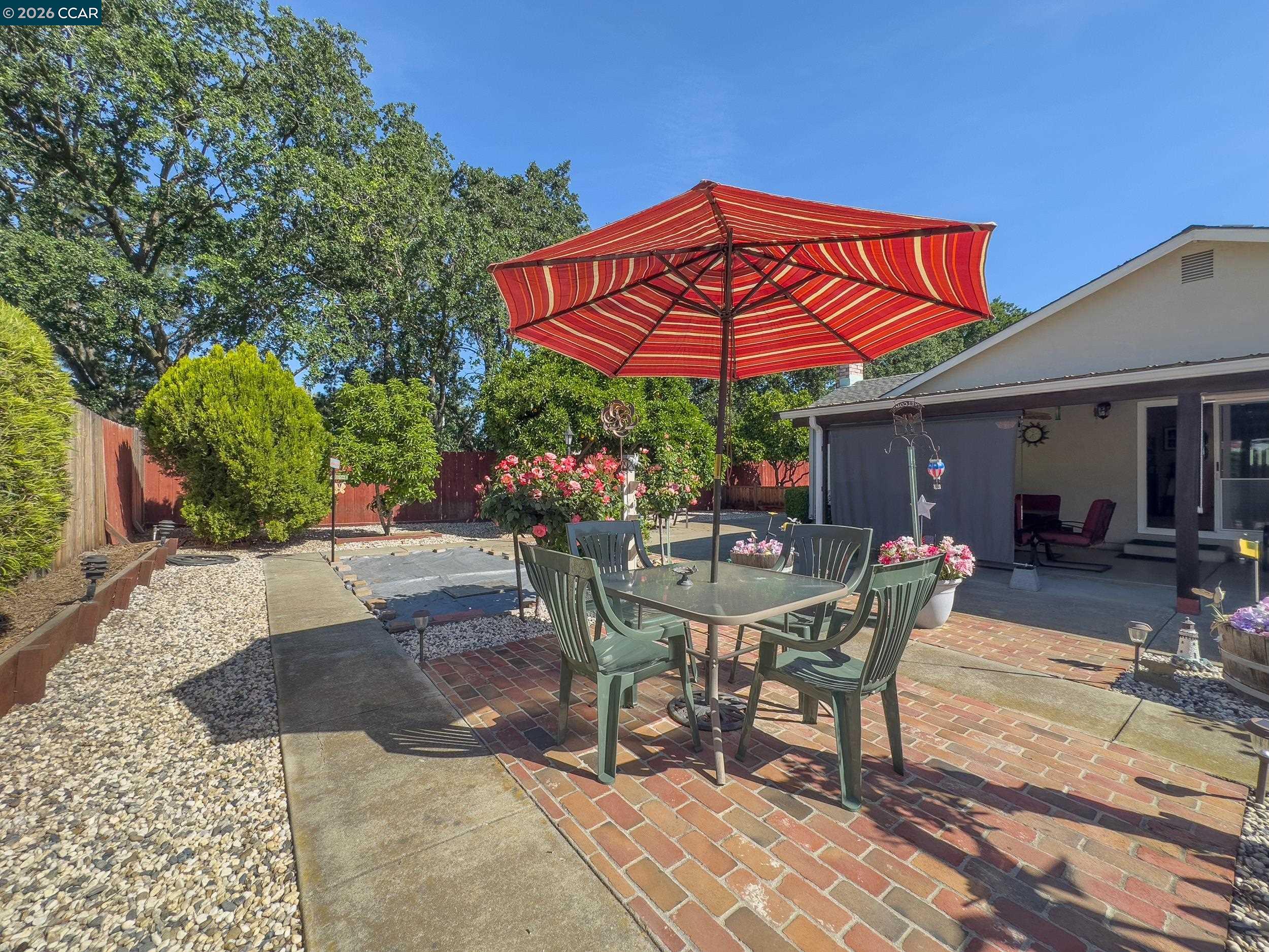 314 Semillon Circle Clayton, CA 94517 - Photo 33 of 38 a view of a table and chairs under an umbrella in patio