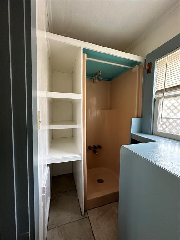 708 J, Unit REAR Galveston, TX 77550 - Photo 6 of 6 a room with cabinets and a window