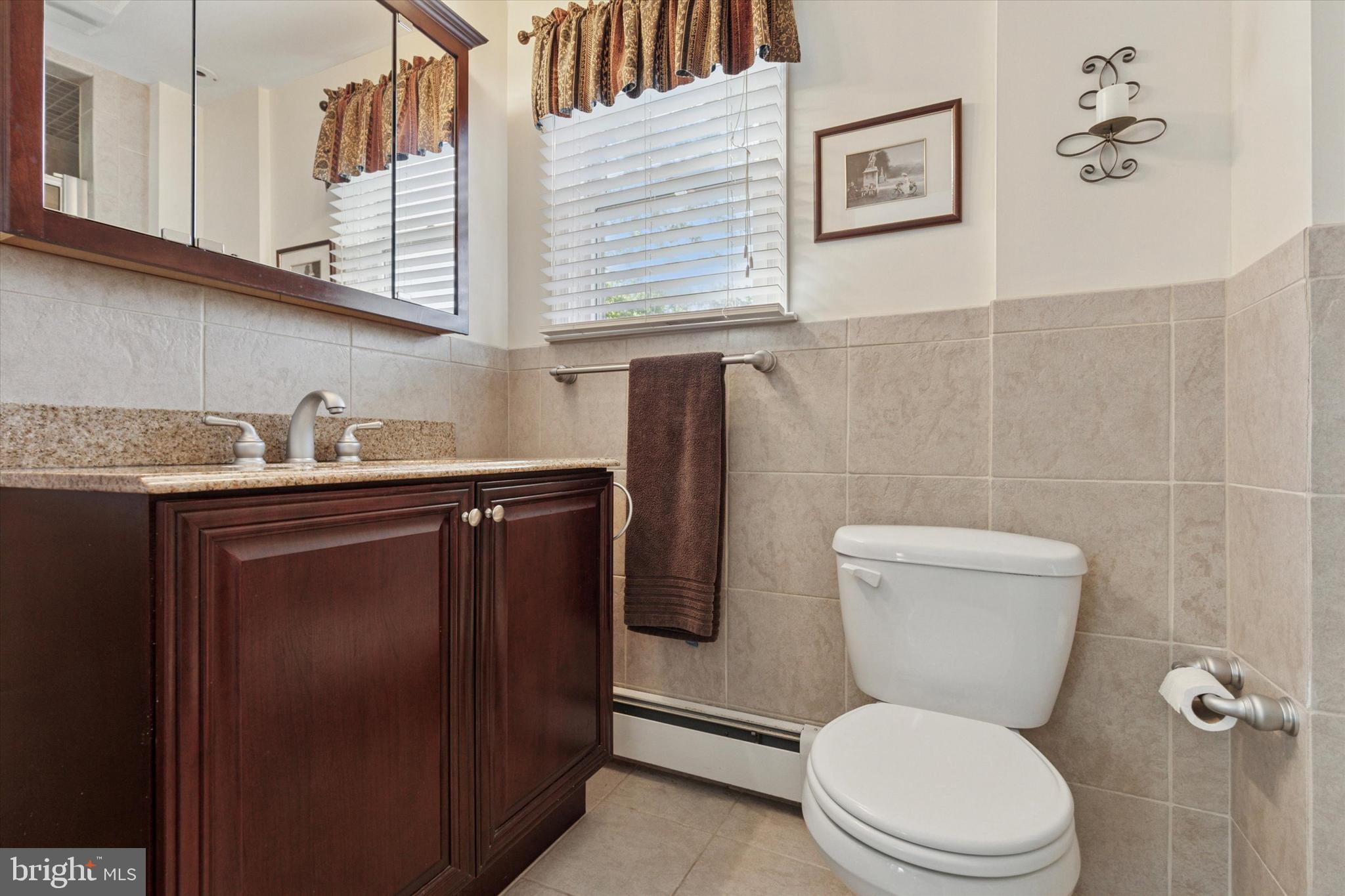 1992 Keswick Way Eagleville, PA 19403 - Photo 13 of 26 a white toilet sitting next to a bathroom sink