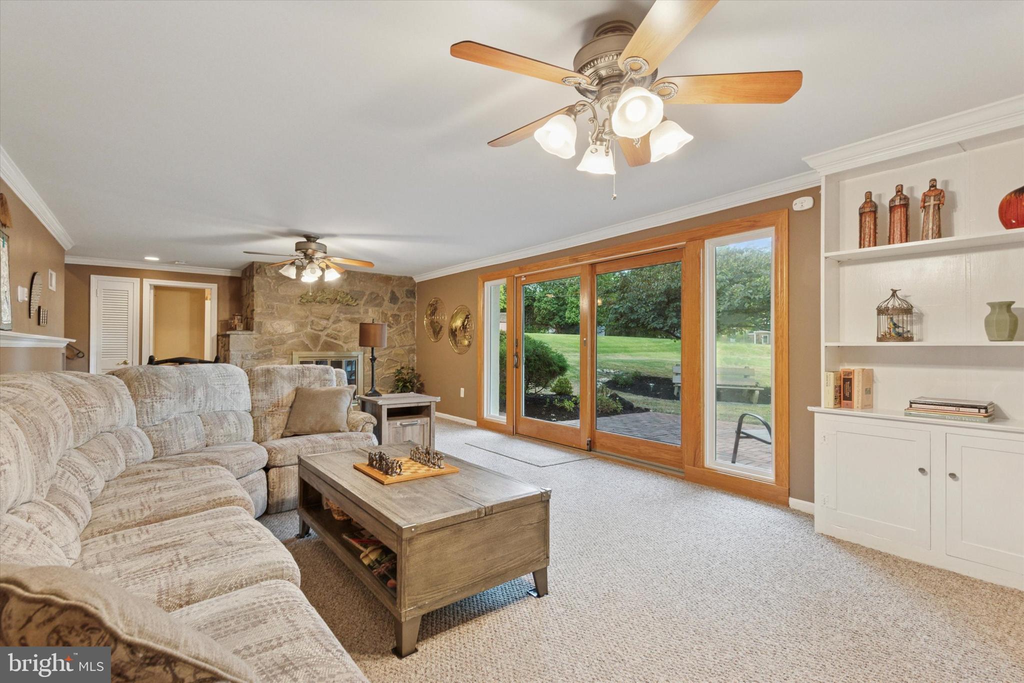 1992 Keswick Way Eagleville, PA 19403 - Photo 21 of 26 a living room with furniture fireplace and a large window