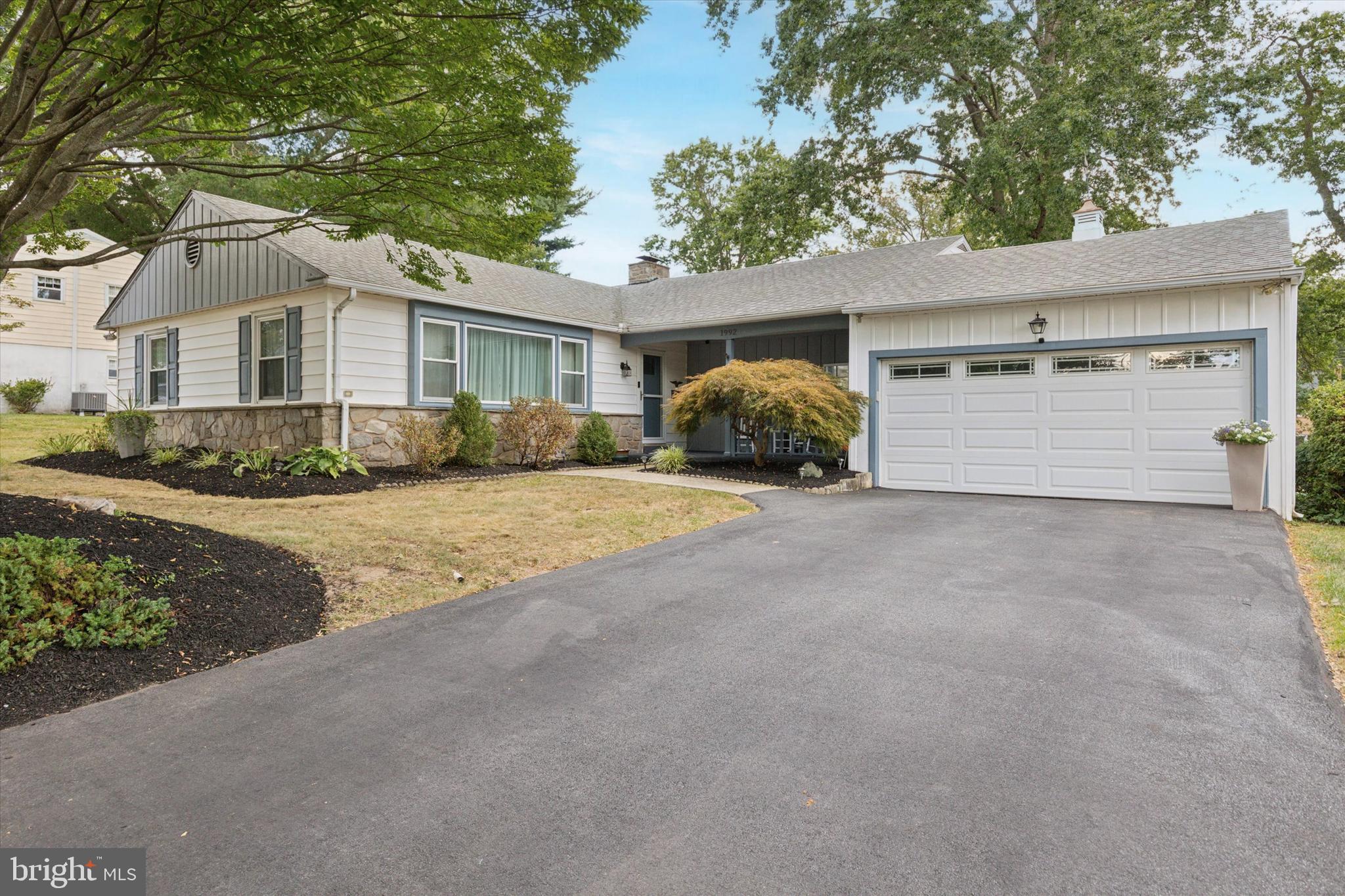 1992 Keswick Way Eagleville, PA 19403 - Photo 26 of 26 a front view of a house with a yard and garage