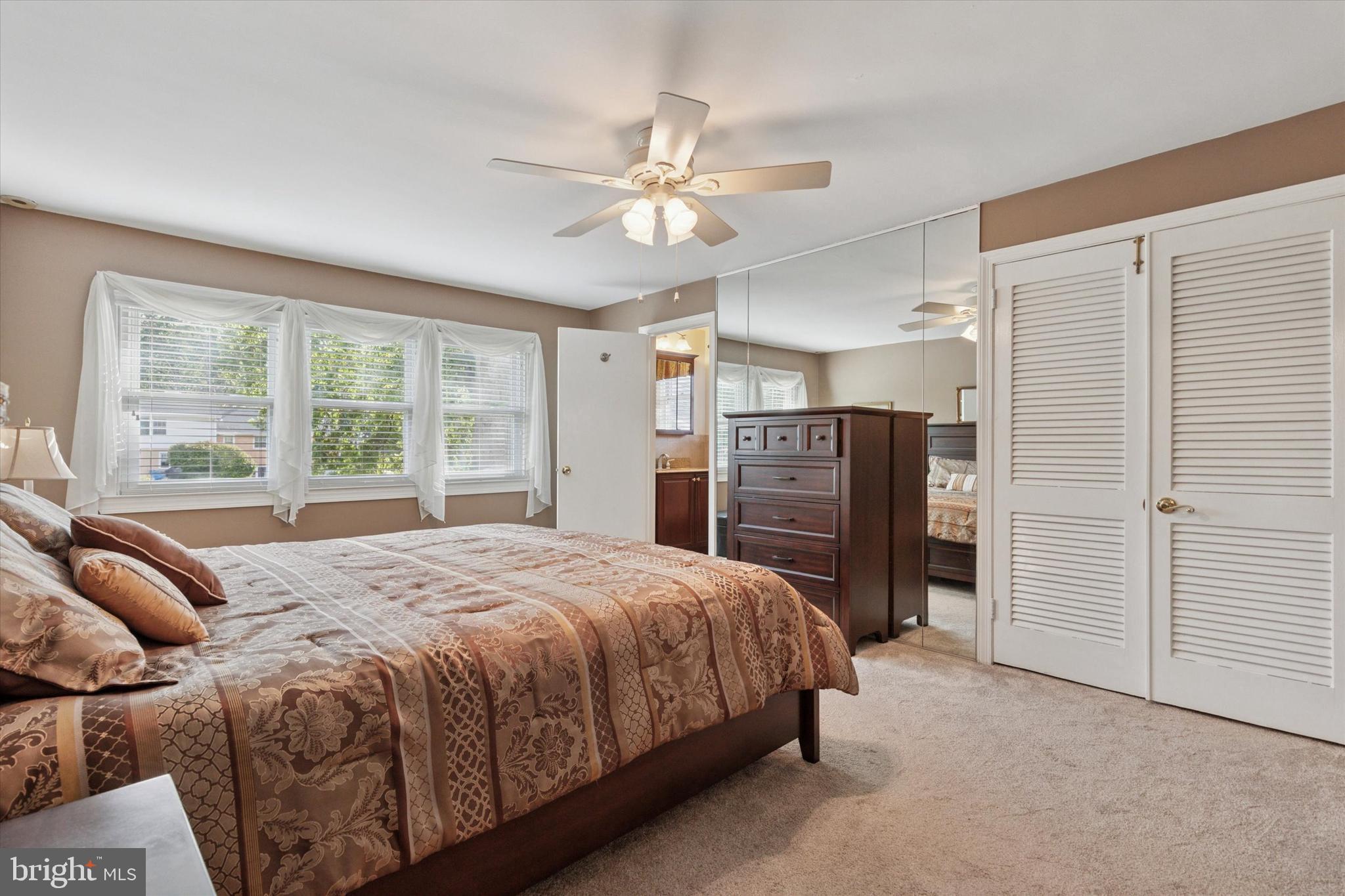 1992 Keswick Way Eagleville, PA 19403 - Photo 10 of 26 a bedroom with a bed closet and a large window