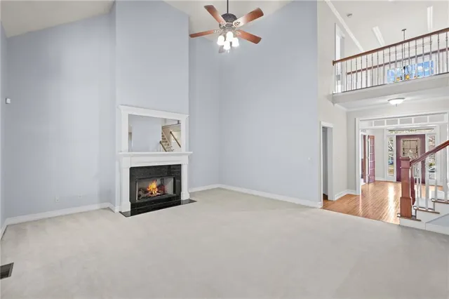 a view of an empty room with a fireplace