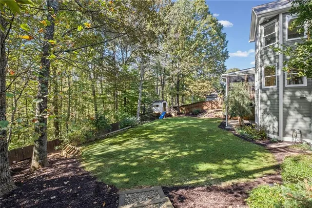 a backyard of a house with lots of green space