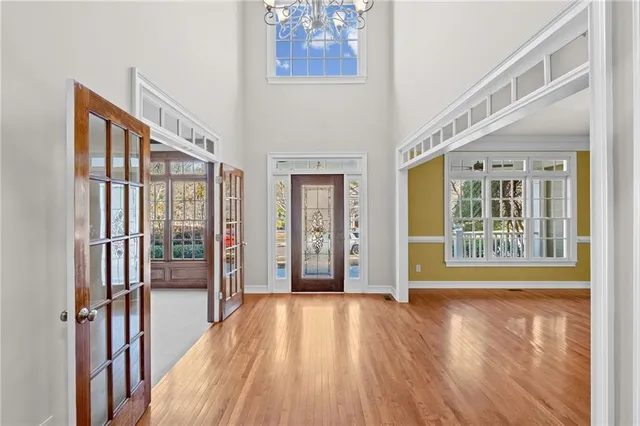 a view of an entryway with wooden floor