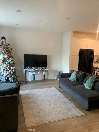 a living room with furniture and flowers