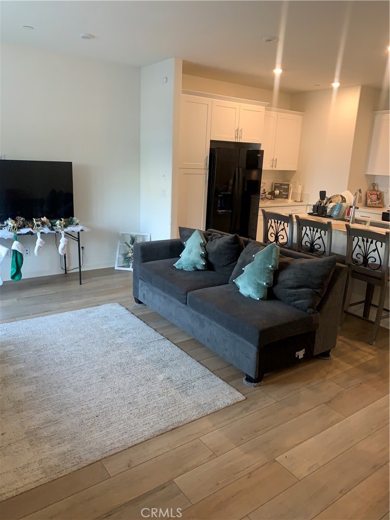985 West Clover Avenue Rialto, CA 92376 - Photo 4 of 11 a living room with furniture and a flat screen tv