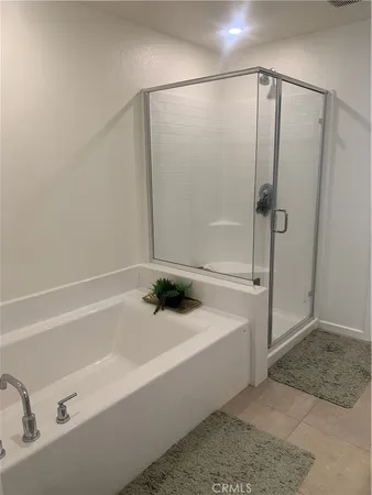 a bathroom with a bathtub and a sink
