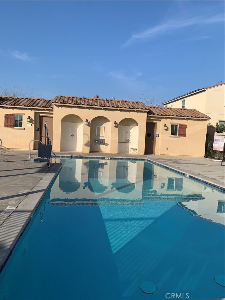 985 West Clover Avenue Rialto, CA 92376 - Photo 10 of 11 a view of a white house with a big yard