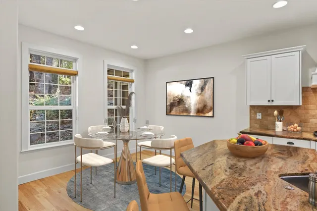 a kitchen with stainless steel appliances granite countertop a sink a stove and a refrigerator