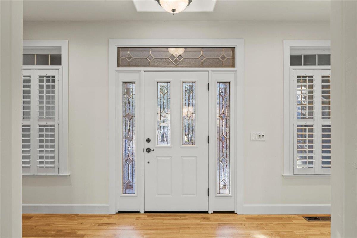 14622 Banner Lava Cap Road Nevada City, CA 95959 - Photo 22 of 66 a view of a livingroom with wooden floor and a window