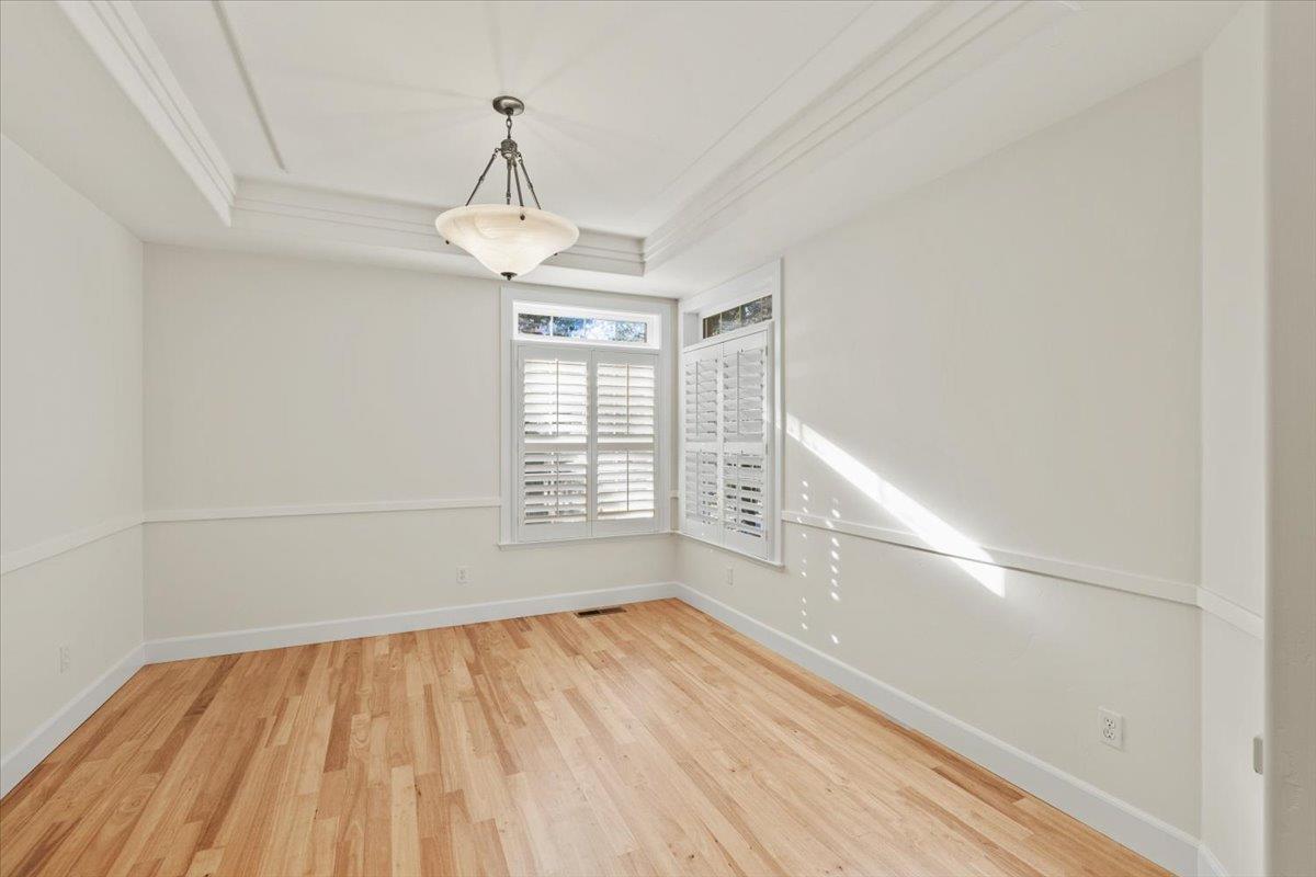 14622 Banner Lava Cap Road Nevada City, CA 95959 - Photo 25 of 66 a view of an empty room with wooden floor and a window