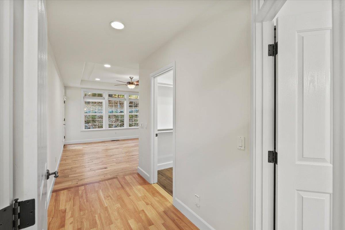 14622 Banner Lava Cap Road Nevada City, CA 95959 - Photo 26 of 66 a view of empty room with wooden floor and fan