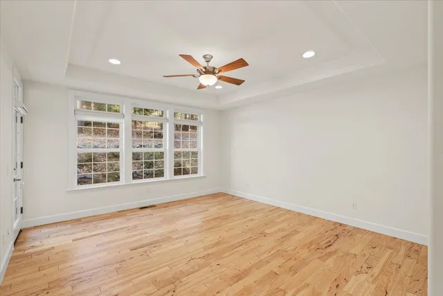 a bathroom with a sink double vanity granite tub shower and a mirror
