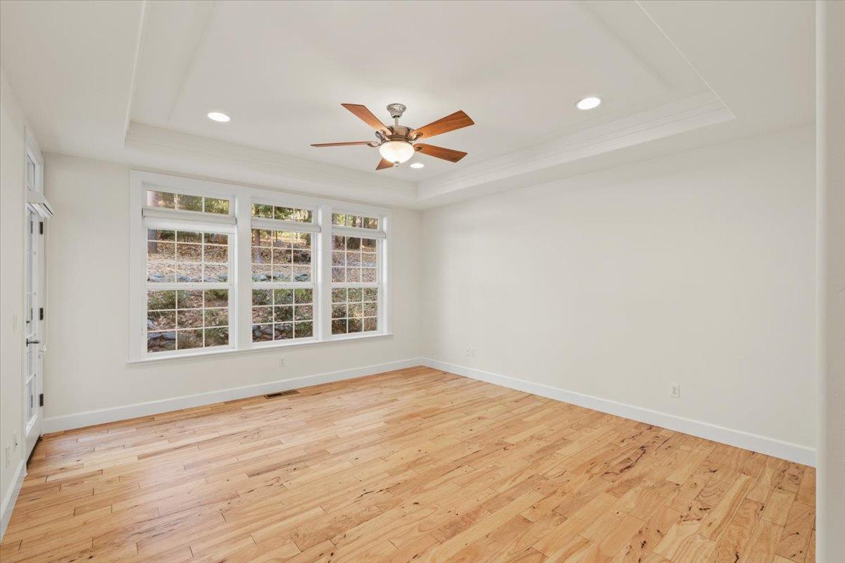 14622 Banner Lava Cap Road Nevada City, CA 95959 - Photo 28 of 66 wooden floor in a empty room with a window