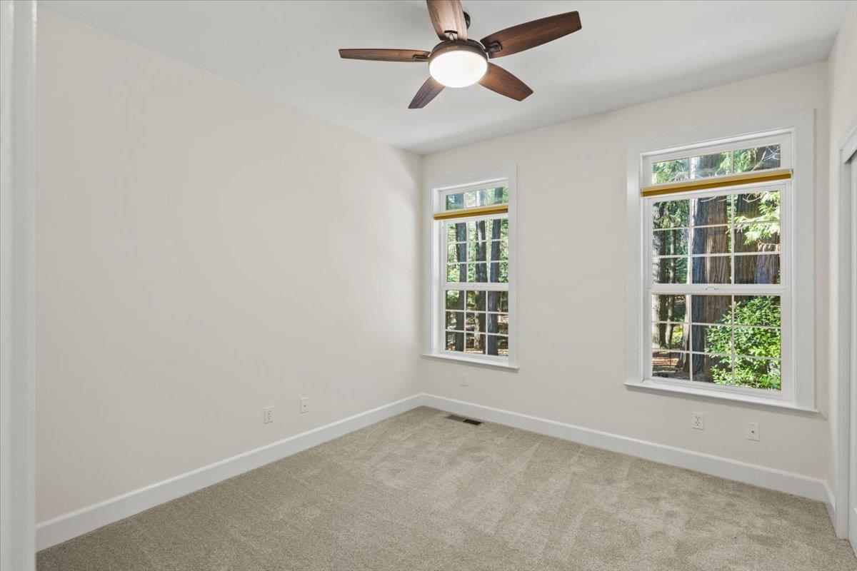 14622 Banner Lava Cap Road Nevada City, CA 95959 - Photo 41 of 66 an empty room with a window and a fan