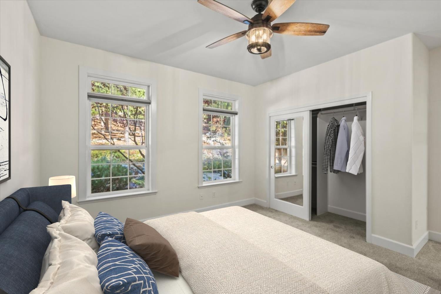 14622 Banner Lava Cap Road Nevada City, CA 95959 - Photo 42 of 66 a bedroom with a large bed and a window