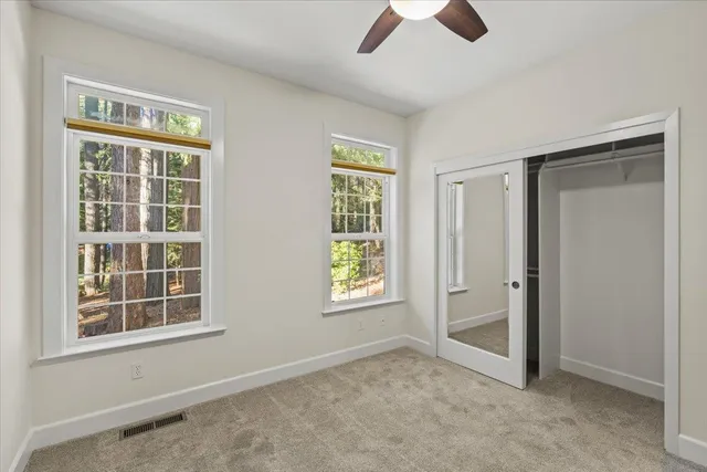 a backyard of a house with lots of green space