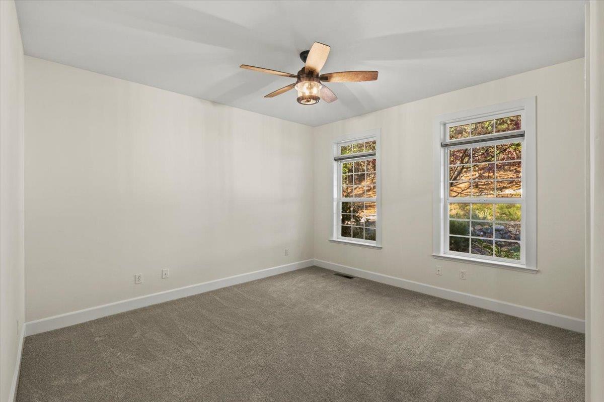 14622 Banner Lava Cap Road Nevada City, CA 95959 - Photo 45 of 66 an empty room with windows and fan