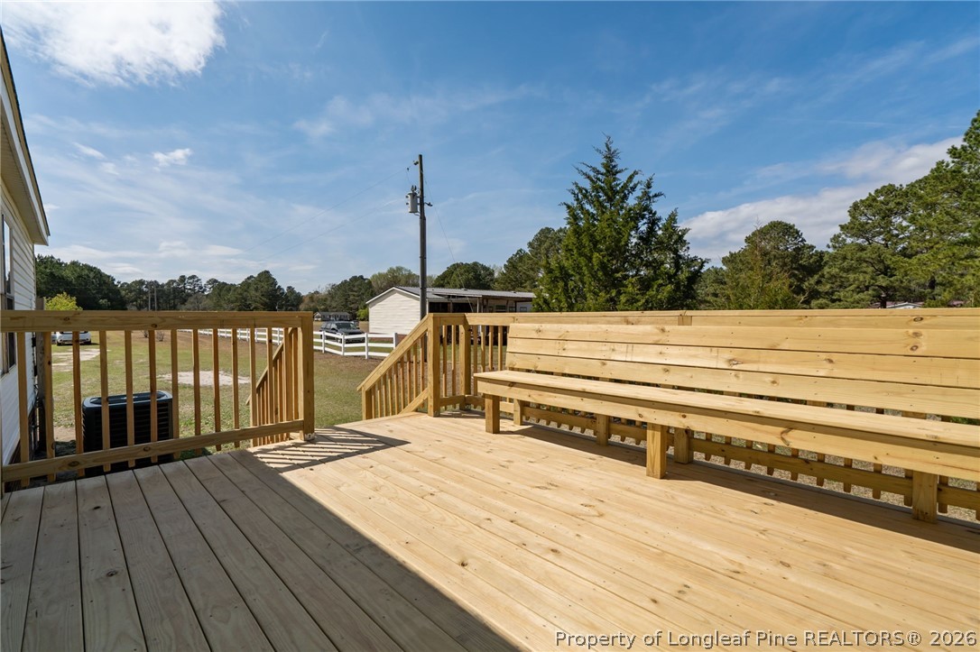 515 Mt Zion Road Red Springs, NC 28377 - Photo 31 of 50 a view of a balcony with wooden floor and outdoor space