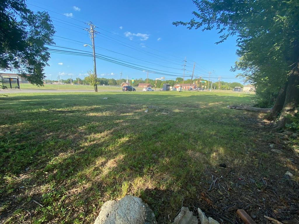 451 North Jim Miller Road Dallas, TX 75217 - Photo 3 of 6 a view of a green field with lots of bushes