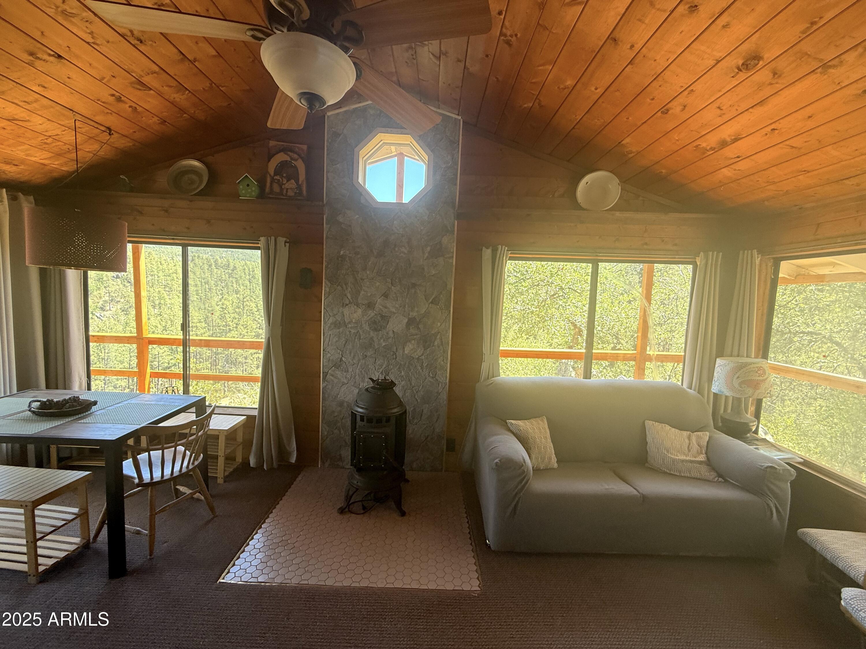 23659 Sunny South Road Crown King, AZ 86343 - Photo 16 of 29 a living room with furniture and a large window