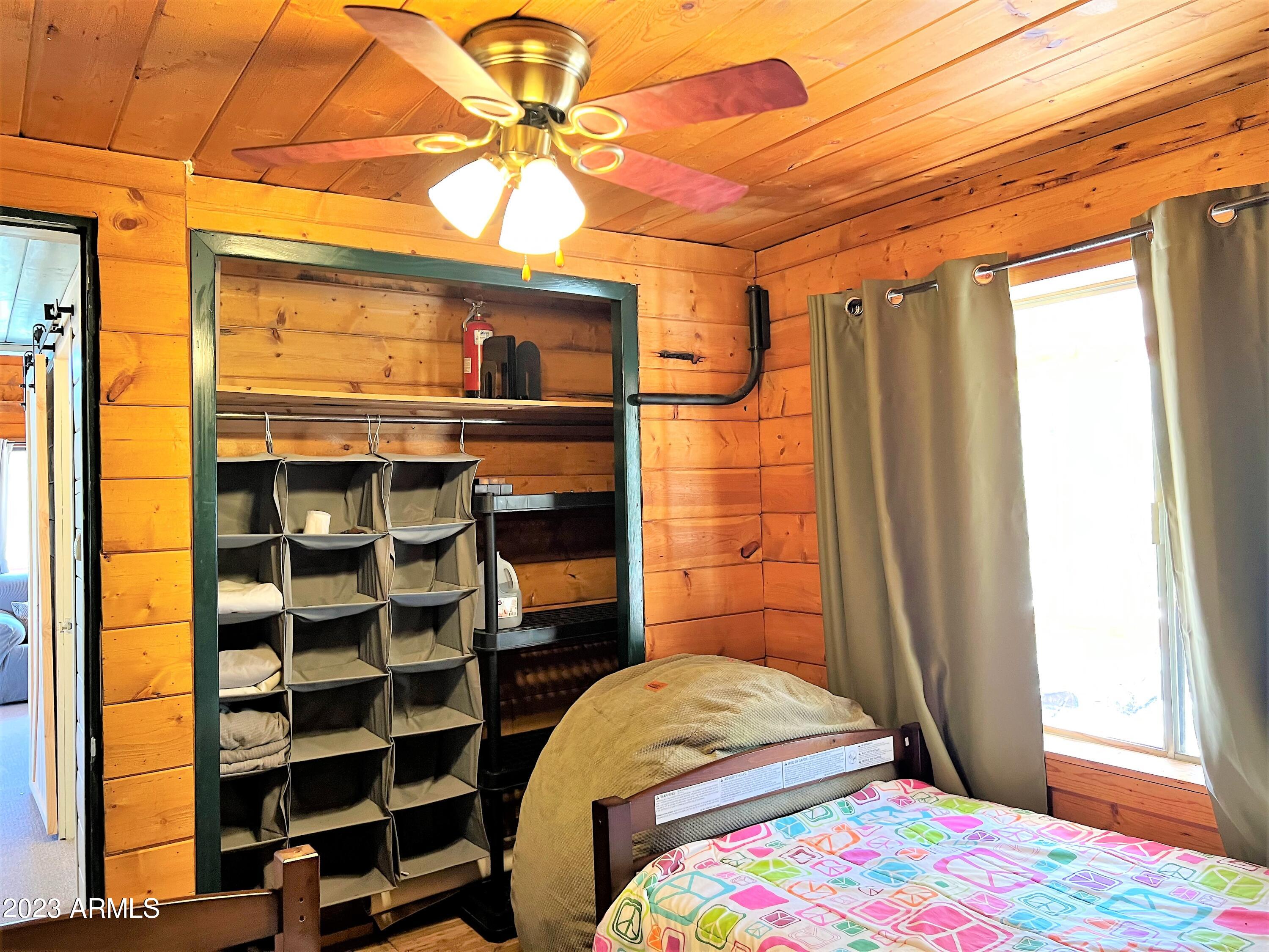 23659 Sunny South Road Crown King, AZ 86343 - Photo 8 of 29 a bedroom with a bed and a window