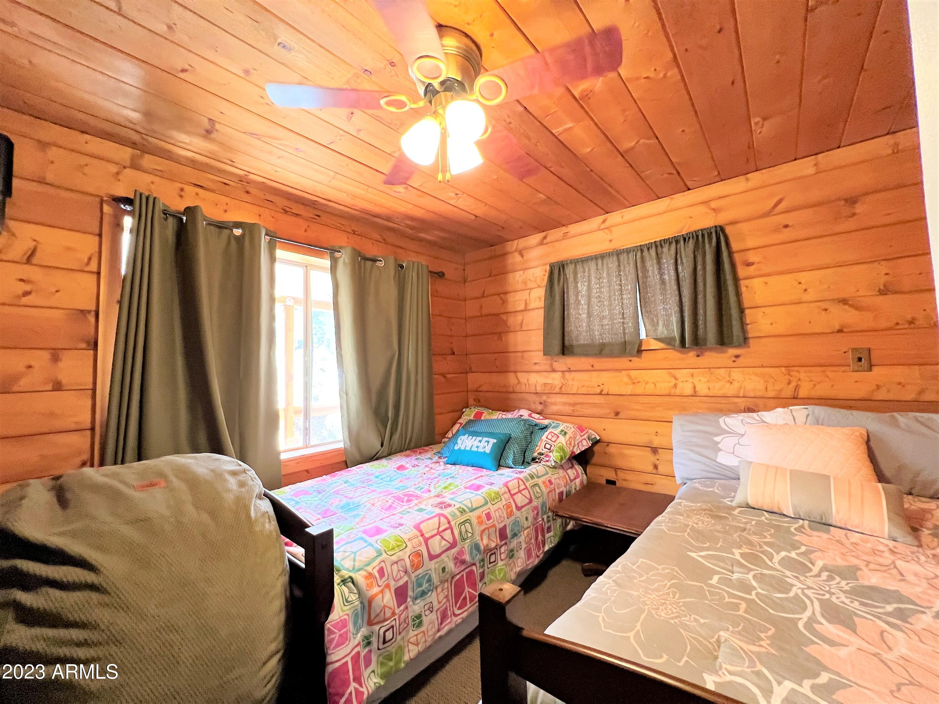 23659 Sunny South Road Crown King, AZ 86343 - Photo 9 of 29 a bedroom with a bed and a window