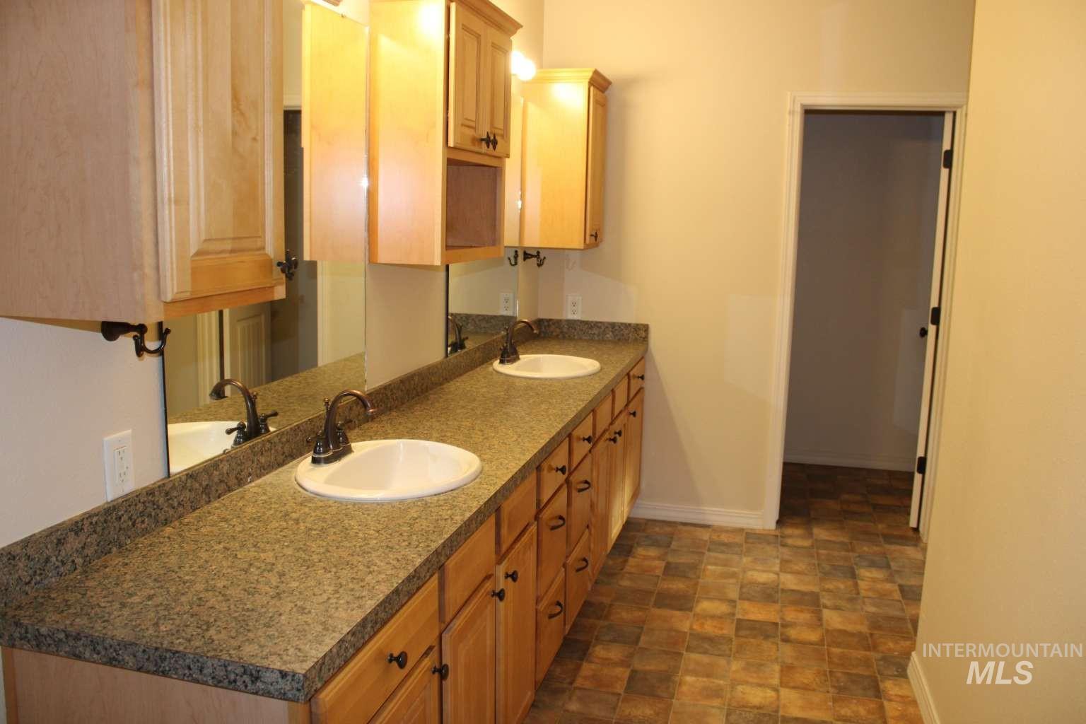 1422 River View Lane Buhl, ID 83316 - Photo 18 of 43 Full bathroom featuring double vanity and stone finish flooring